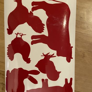 a group of animals on a white surface