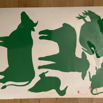 a green silhouettes of animals on a white surface