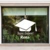 Hoera geslaagd super gedaan 3 a window with a picture of a graduation cap and potted plants