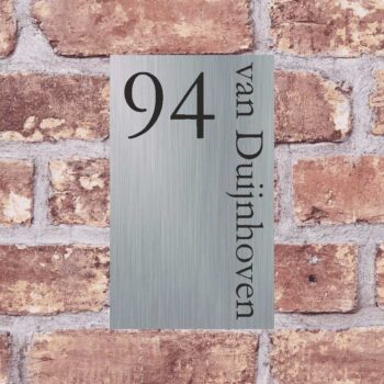 a sign on a brick wall