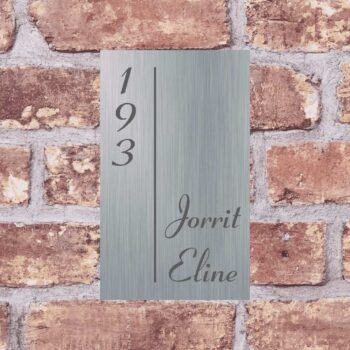 a sign on a brick wall