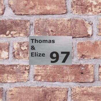 a brick wall with a sign