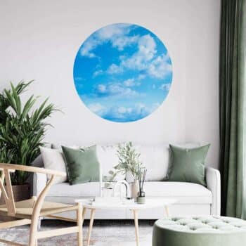 a room with a couch and a round blue circle on the wall