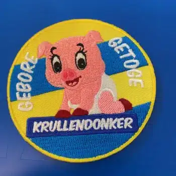 Embleem Gebore en getoge krullendonker