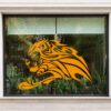 a lion with a fire design on a window