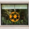 a window with a football ball on it