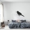Muursticker lijster boven het bed in de slaapkamer