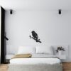 Muursticker spreeuw boven het bed in de slaapkamer