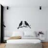 Muursticker zingende vogels boven het bed in de slaapkamer