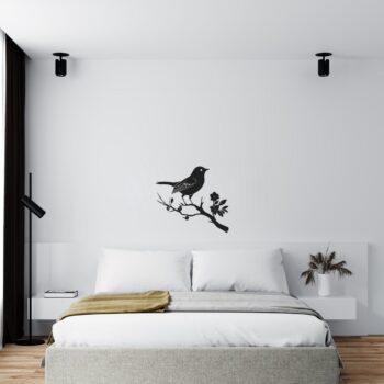 Muursticker vogel op bloementak boven het bed in de slaapkamer