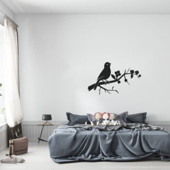 Muursticker vogeltje op bloesemtak boven het bed in de slaapkamer