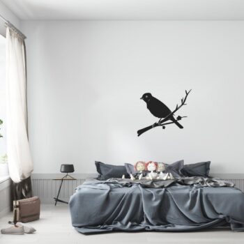 Muursticker vogeltje op tak boven het bed in de slaapkamer