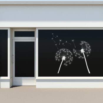 Raamsticker Paardenbloem pluizenbollen in wit op een etalageraam